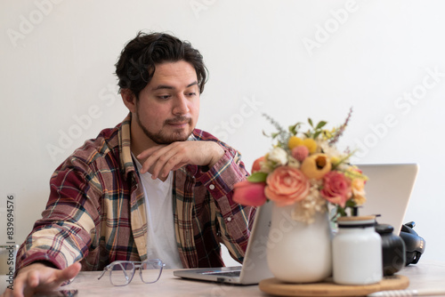 Young man making video call in the living room with happiness