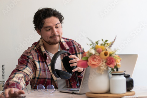 Young boy preparing his set to get fun with his laptop and play with headset