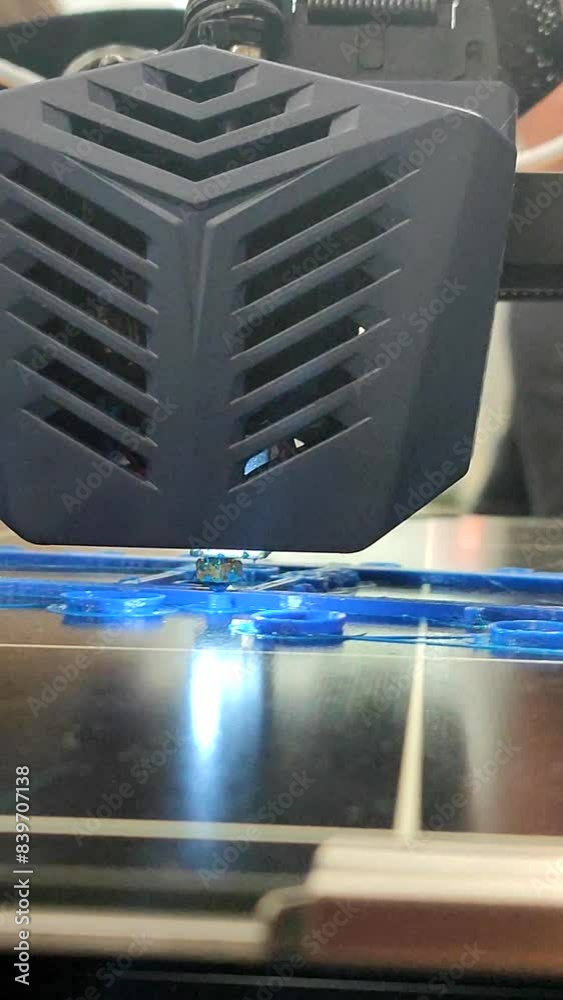 Process of printing object on 3D printer from molten plastic. 3D printer printing model using plastic from extruder. 3D printing technology. New modern additive prototyping technologies. Vertical Process of printing object on 3D printer from molten plastic. 3D printer printing model using plastic from extruder. 3D printing technology. New modern additive prototyping technologies. Vertical