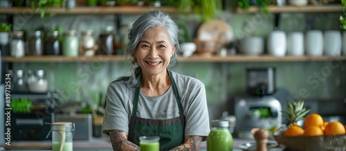healthy asian aunt retired female woman enjoy making cook clean food breakfast for her healthy food lifestyle,smiling cheerful woman silver hair with tattoo prepare smoothie juice drink for her healtH photo