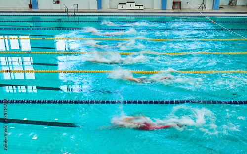 Turquoise swimming pool lanes, a symbol of sport