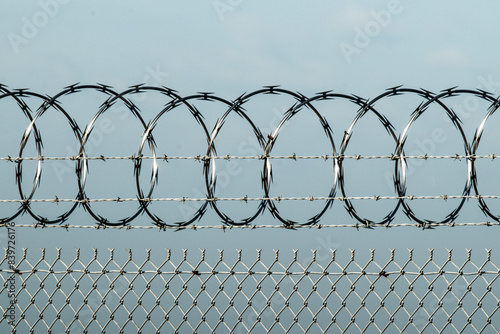 Razor wire attached to chain link fence