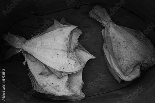 dry fish on a wooden plate