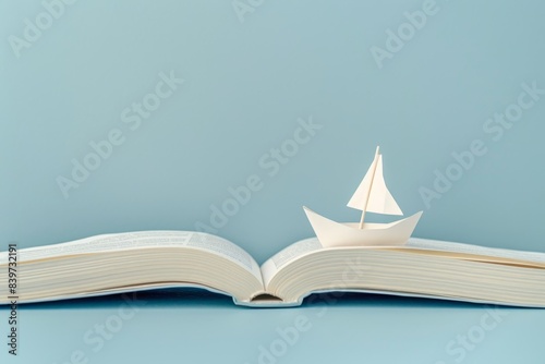 Knowledge is like a boat on an open book photo