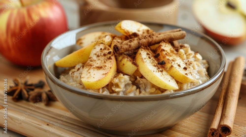 A bowl of oatmeal topped with cinnamon and sliced apples a tasty and nourishing breakfast to fuel the brain A bowl of oatmeal topped with cinnamon and sliced apples a tasty and nourishing breakfast to fuel the brain
