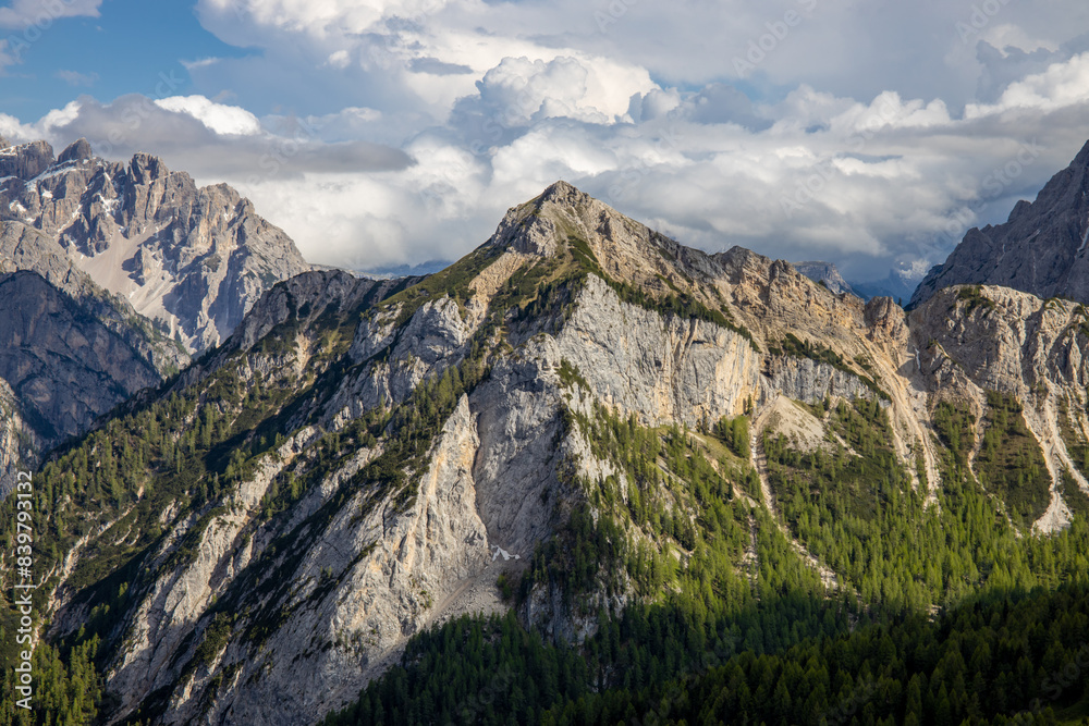 Obraz premium Dolomites mountains, Alpi Dolomiti beautiful scenic landscape in summer. Italian Alps mountain summits and rocky peaks above green valley alpine scene