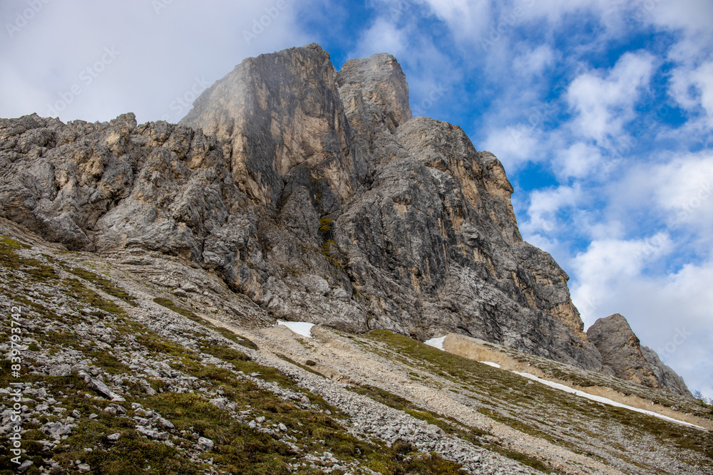 Obraz premium Dolomites mountains, Alpi Dolomiti beautiful scenic landscape in summer. Italian Alps mountain summits and rocky peaks above green valley alpine scene