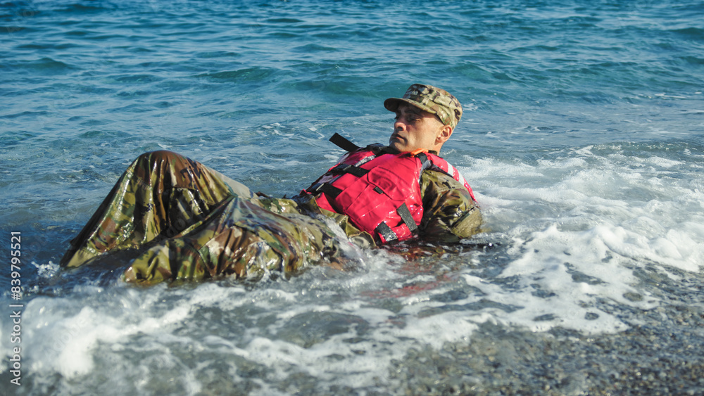 Obraz premium Military man with camouflage and life jacket as safety concept