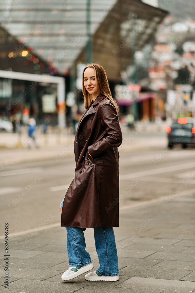 Fototapeta premium A Casual Girl Poses with Confidence and Style on Urban Streets