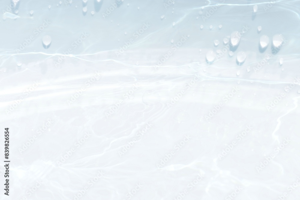 Blue water with ripples on the surface. Defocus blurred transparent blue colored clear calm water surface texture with splashes and bubbles. Water waves with shining pattern texture background. Blue water with ripples on the surface. Defocus blurred transparent blue colored clear calm water surface texture with splashes and bubbles. Water waves with shining pattern texture background.