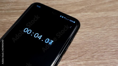 A smartphone on the table with 10 second timer on screen
