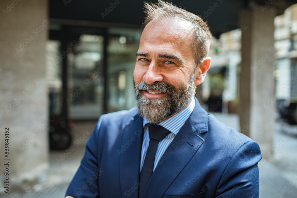 Portrait of a smiling businessman standing in the city Portrait of a smiling businessman standing in the city