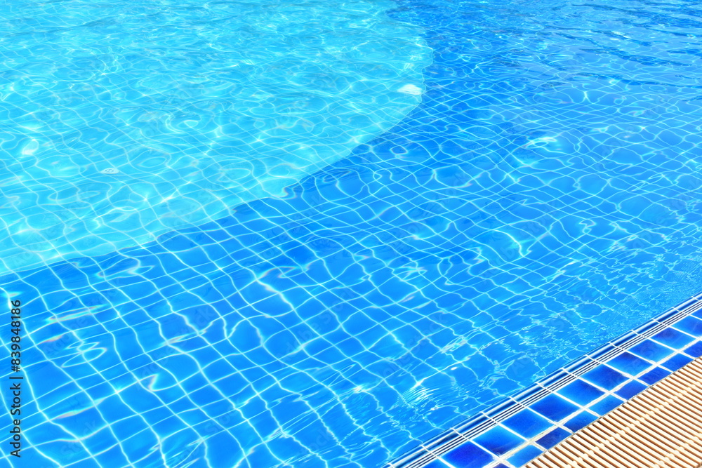 surface of blue swimming pool with water drain