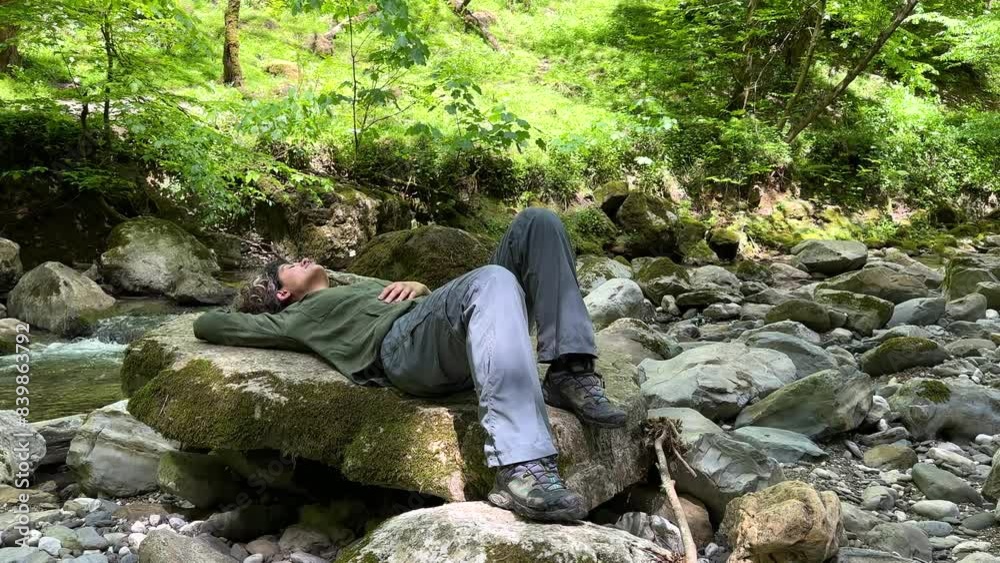 Lying on a flat scenic rock stone in riverside nature landscape background fresh nature wonderful summer season vacation relaxing trip hiking calm remote mountain wide panoramic view on Dorfak Iran Lying on a flat scenic rock stone in riverside nature landscape background fresh nature wonderful summer season vacation relaxing trip hiking calm remote mountain wide panoramic view on Dorfak Iran