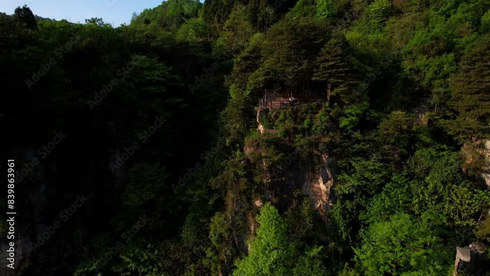 Forward drone approaching tourist couple enjoying views of Tianzi Shan Mountain in China Forward drone approaching tourist couple enjoying views of Tianzi Shan Mountain in China