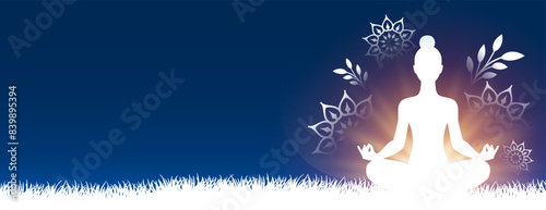 international yoga day. woman doing posture in grass with text space