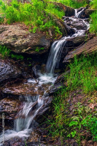 Spring waterfall on a stream flowing from the Ural Mountains