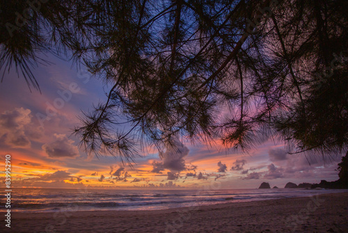 Sunset view on a quiet white sandy beach