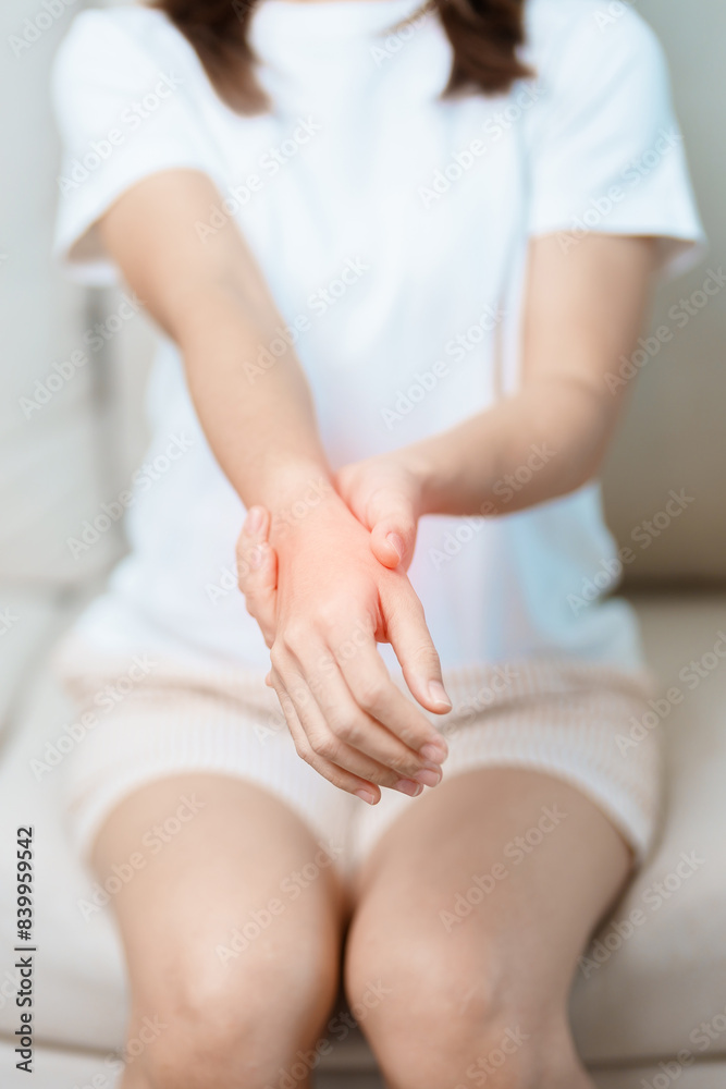 Woman having wrist pain at home, muscle ache due to De Quervain s tenosynovitis, ergonomic, Carpal Tunnel Syndrome or Office syndrome and Parkinson disease concept Woman having wrist pain at home, muscle ache due to De Quervain s tenosynovitis, ergonomic, Carpal Tunnel Syndrome or Office syndrome and Parkinson disease concept