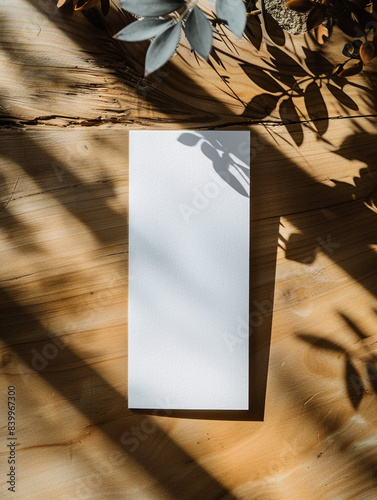 Mockup of a blank white bookmark on a table