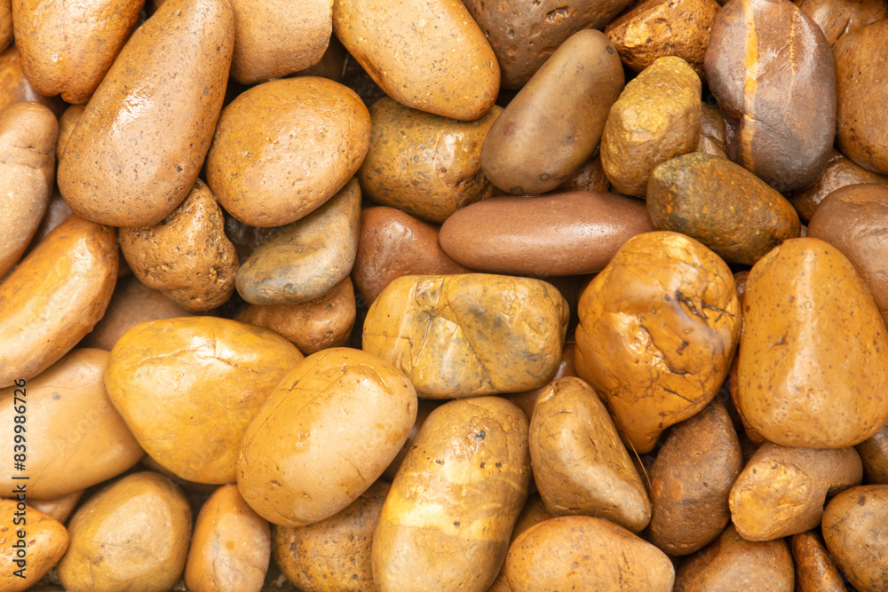 Round stones in the wall as an abstract background. Texture Round stones in the wall as an abstract background. Texture