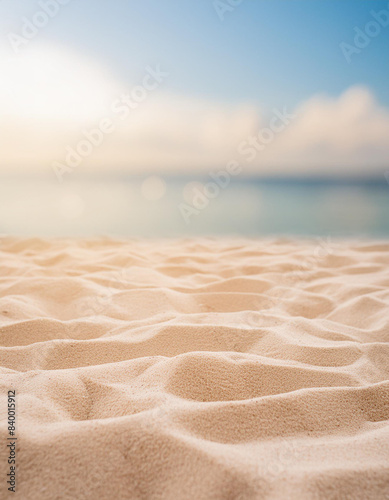 Seascape abstract beach background blur light of calm sea and sky focus on sand foreground