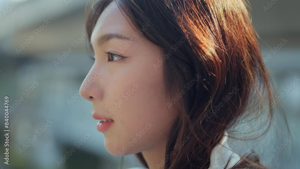 Close up - Attractive young asian woman opens his black eyes on a blurred background city, Enjoy moment of peace, Happy young woman enjoys life Close up - Attractive young asian woman opens his black eyes on a blurred background city, Enjoy moment of peace, Happy young woman enjoys life