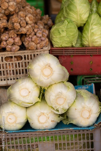 Fresh vegetables on display in a traditional market
