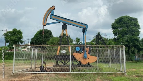 pump jack, oil production proses, Pumping oil and gas from the ground photo