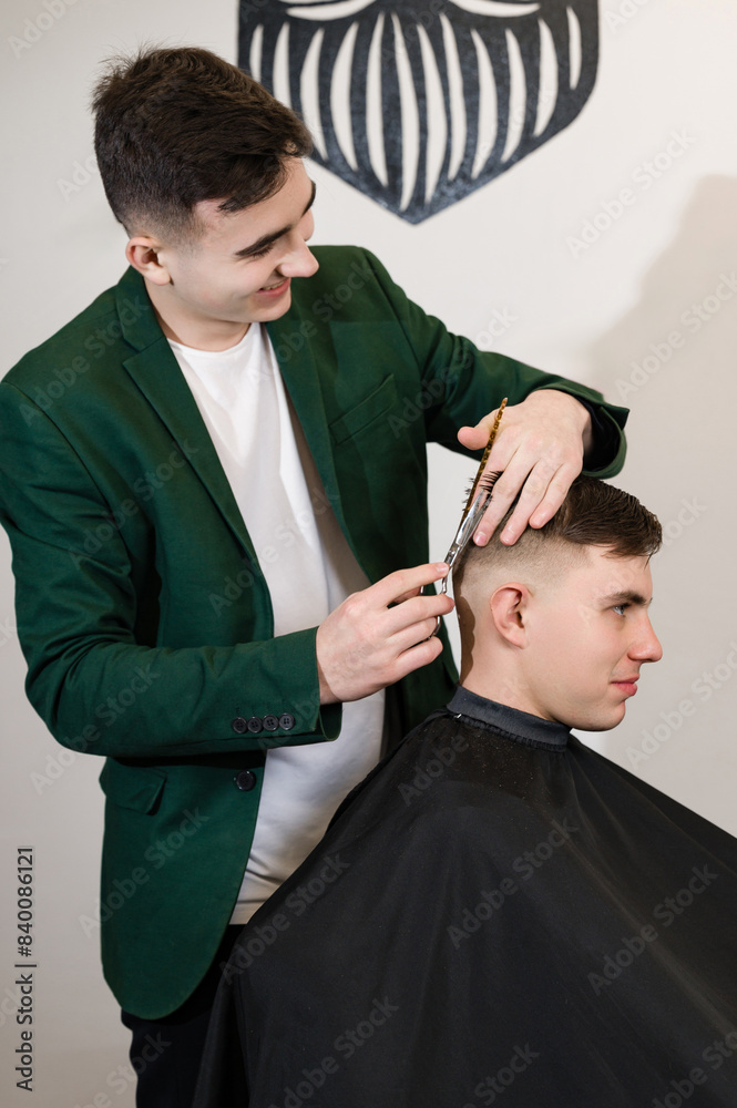 Haircut alignment of the contour of the head with scissors. Short haircut in the barbershop. Haircut alignment of the contour of the head with scissors. Short haircut in the barbershop.