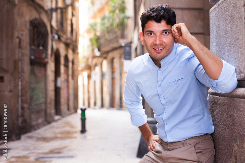 Smiling young guy on city street Smiling young guy on city street
