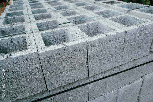 Construction concrete block. Industrial production of building cement pressed materials. Concrete Cinder Blocks. Vibration-pressed hollow building block.