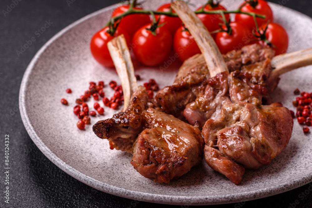 Delicious juicy meat on the bone or rack of lamb or grilled veal Delicious juicy meat on the bone or rack of lamb or grilled veal