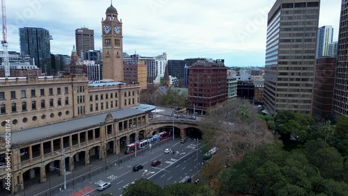 Landscape view of cars on busy main street Central Station Clock Tower building in Sydney City CBD skyline Haymarket Surry Hills Australia travel tourism photo