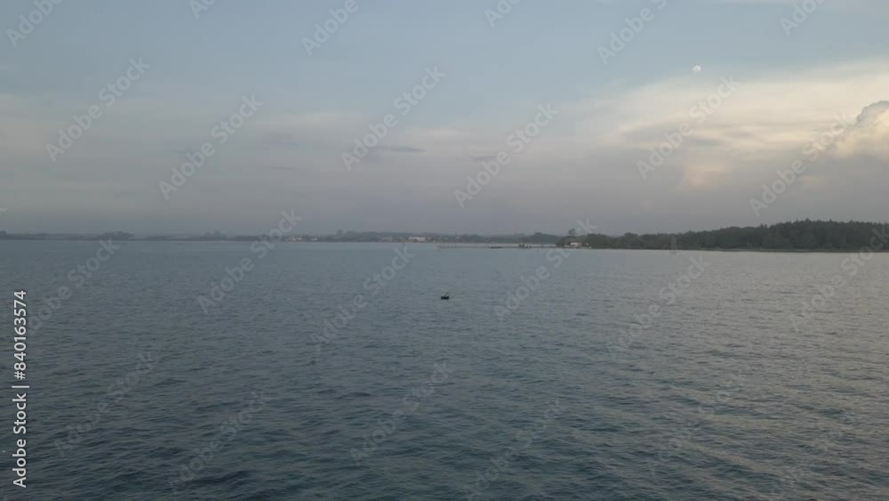 ocean atmosphere in the afternoon. The drone flies across the ocean towards the beach ocean atmosphere in the afternoon. The drone flies across the ocean towards the beach
