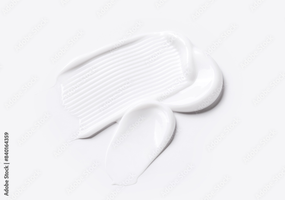 samples of cosmetic care products smear of cream texture on a light background samples of cosmetic care products smear of cream texture on a light background