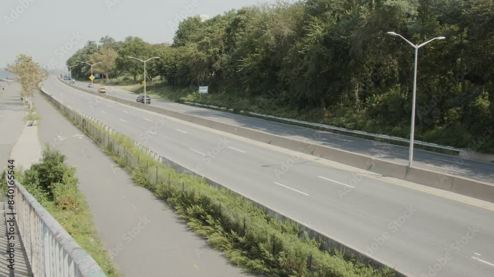 Highway with 6 lanes, with cars, in a wide shot on an somber overcast day. Highway with 6 lanes, with cars, in a wide shot on an somber overcast day.