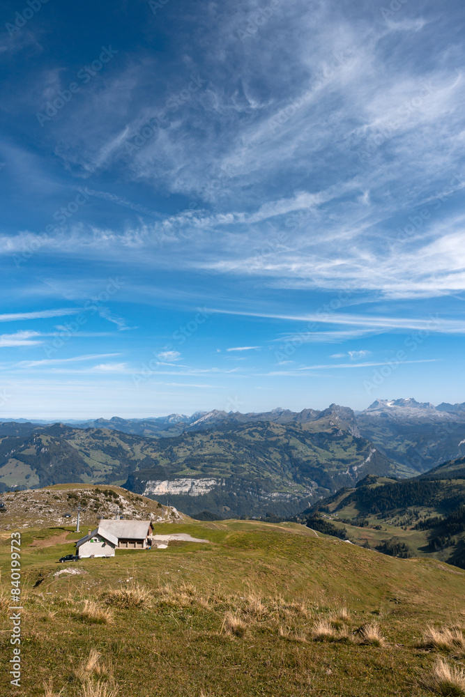 Mountain hut and cable car seen from Fronalpstock summit, Switzerland. Swiss Alps iconic view