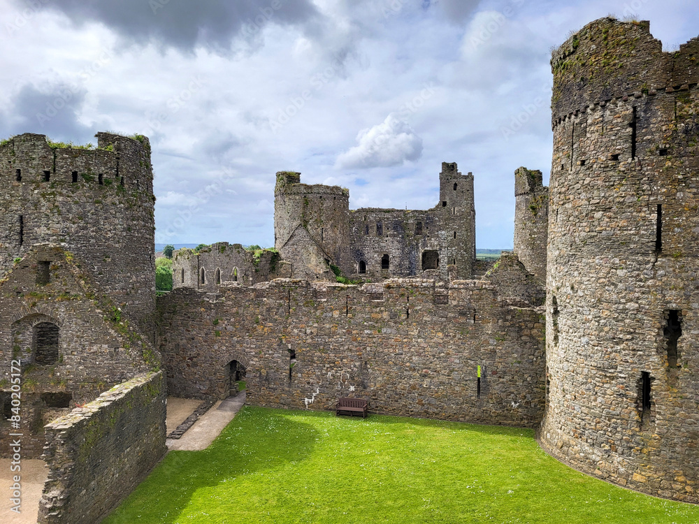 Kidwelly Castle was built in the early 12th century as a Norman 'ringwork' castle made of wood and protected only by an earthen bank and ditch - by 1280 it had been rebuilt in stone. Kidwelly Castle was built in the early 12th century as a Norman 'ringwork' castle made of wood and protected only by an earthen bank and ditch - by 1280 it had been rebuilt in stone.