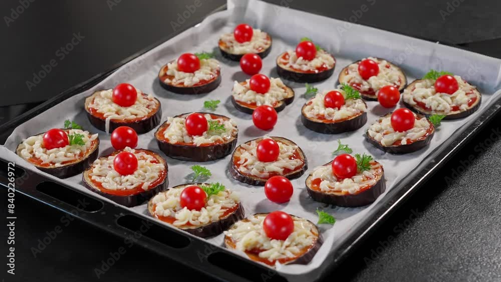 Cooked eggplants with tomato sauce, cheese and cherry tomatoes on deco, camera moving in a circle. Healthy food, vegetables, eggplant dishes, vegetarian food, baked eggplant, snack. Macro, side view Cooked eggplants with tomato sauce, cheese and cherry tomatoes on deco, camera moving in a circle. Healthy food, vegetables, eggplant dishes, vegetarian food, baked eggplant, snack. Macro, side view