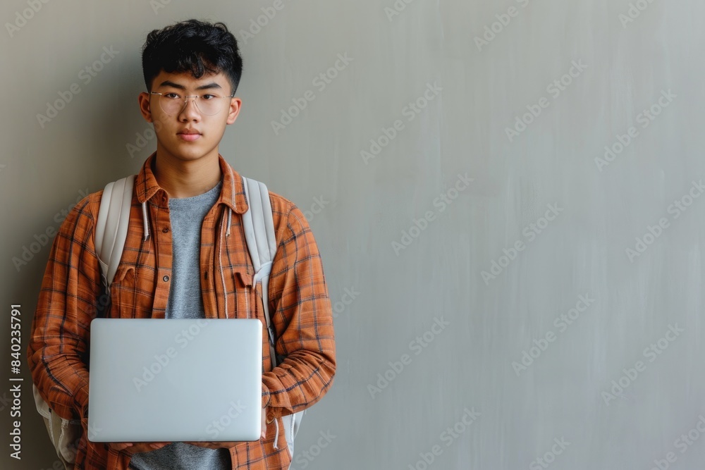 A person sitting with a laptop, great for tech-related content or illustrating an individual working remotely A person sitting with a laptop, great for tech-related content or illustrating an individual working remotely