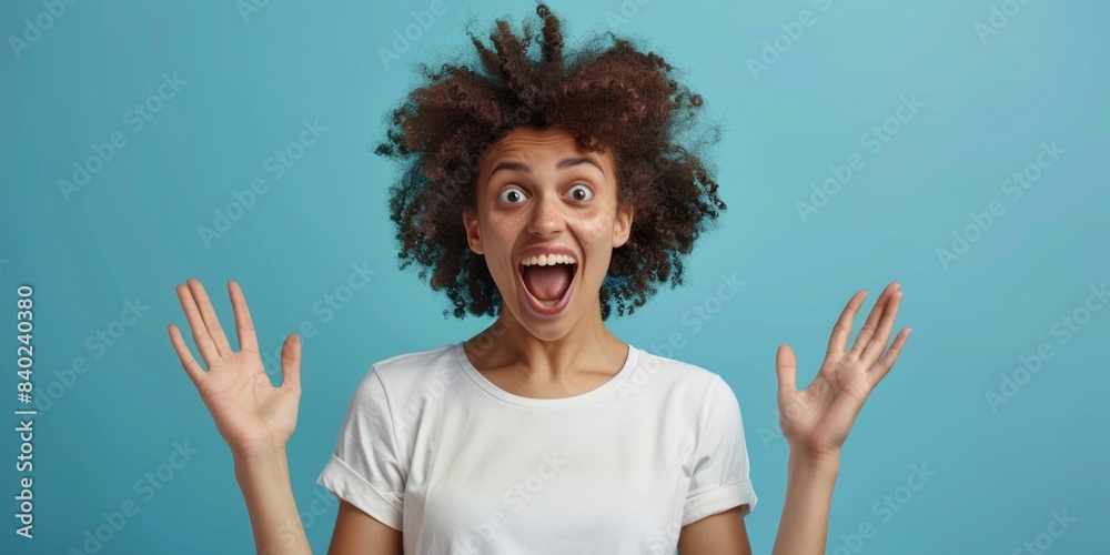 A woman posing with a silly expression, hands shaped into a comical shape A woman posing with a silly expression, hands shaped into a comical shape
