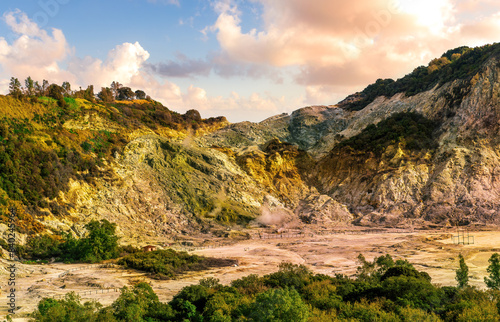 landscape of Plegrean volcano fields in Naples Italy near Pompeii with sulfur yellow caldera duribg eruption of smoke. campi Flegrei and cataclysm of Earthquake photo
