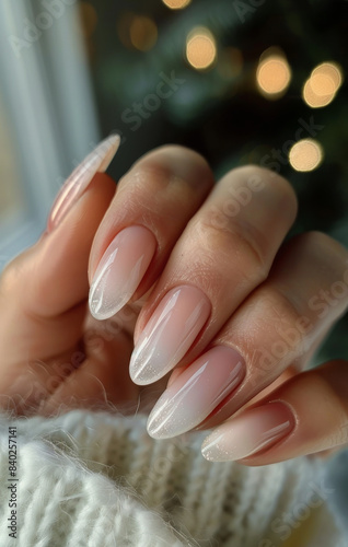 Ombre Nail Polish on Long Oval Nails With White Knitted Fabric Background