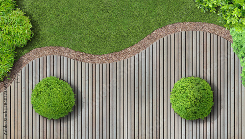 Modern garden design in aerial view with larch wood terrace and boxwood balls
