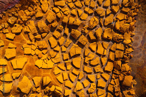 Cracked earth textures at Riotinto mining site photo