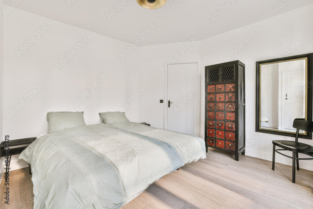 Minimalist Bedroom with Twin Beds and Antique Cabinet Minimalist Bedroom with Twin Beds and Antique Cabinet