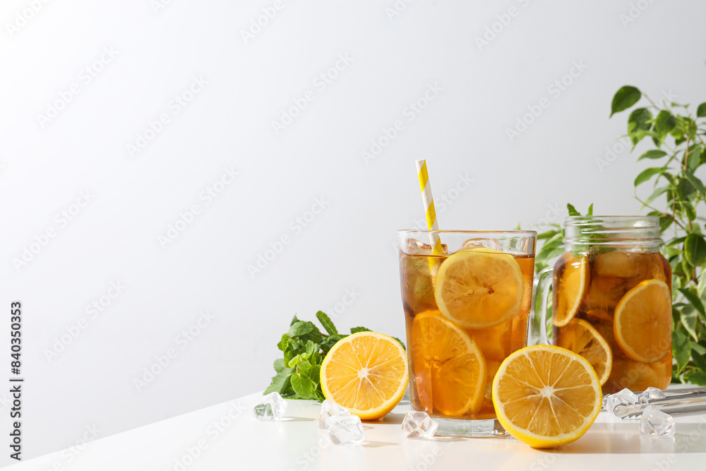 Fototapeta premium Cold tea with fresh oranges and mint leaves