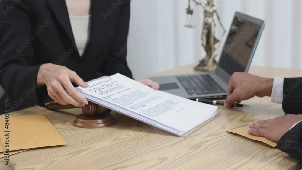 Judge Hammer and Lawyer Justice have a team meeting at the law office in the background. lawyer in office Concept of law and justice Judge Hammer and Lawyer Justice have a team meeting at the law office in the background. lawyer in office Concept of law and justice
