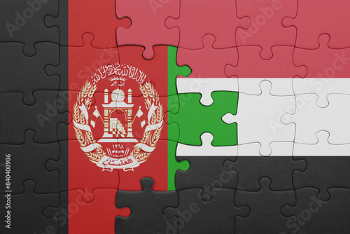 puzzle with the colourful national flag of yemen and flag of afghanistan. photo